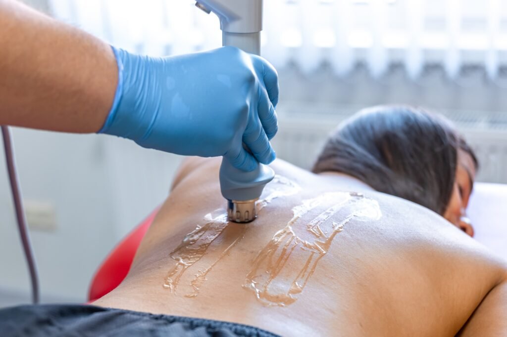 Extracorporeal shockwave therapy, physical therapy for neck and back muscles.